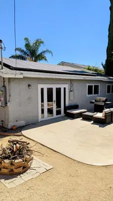 a building with a patio with two benches in front of it at Serene home in Simi valley, CA in Simi Valley