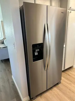 a stainless steel refrigerator with a paper dispenser on it at Modern Private 3B-2BA Home and Spacious Yard in Lancaster