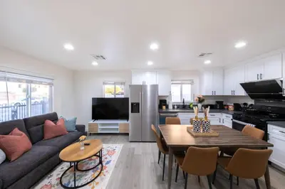 a living room with a couch and a table at Modern Private Room in Shared Home -Walk to USC in Los Angeles