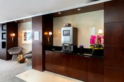 a hotel room with a drink dispenser in a room at Platinum Suites - Gym & Pool & Hot Tub & BBQ in Los Angeles