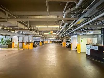an empty parking garage with cars parked in it at Cozy 2BR Loft in a Vibrant Complex - 107 - GL in Glendale