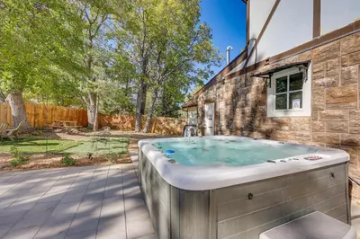 a hot tub in the backyard of a house at Beautiful Lake-View House Walk to Lake and Village! in Big Bear Lake