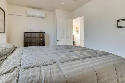 a bedroom with a bed and a dresser at Near Hospitals and Metrolink Access LA Getaway in Los Angeles