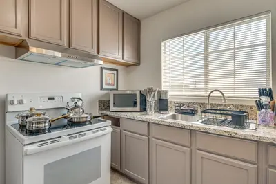 a kitchen with a stove and a sink at Near Hospitals and Metrolink Access LA Getaway in Los Angeles