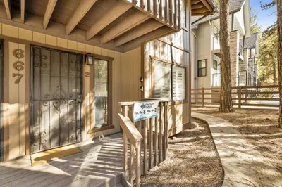 a front door of a house with a sign on it at Summit Ski Resort Mountain View Condo - Walk to Snow Summit in Big Bear Lake