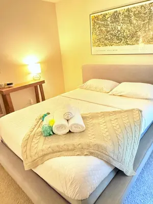 a bed with two towels and two stuffed animals on it at Luxury stay by Gaia Homes in Los Angeles
