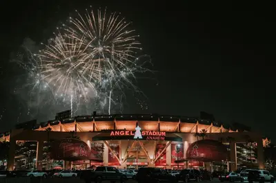 a fireworks display over a baseball stadium with a field at Luxury Stay Near Disneyland With Pool Gym & Free Parking in Santa Ana