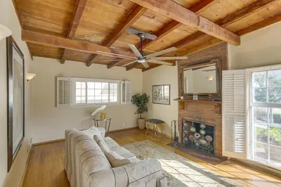a living room with a couch and a fireplace at Less Than 1 Mi to Universal Studios Home with Private Pool in Los Angeles
