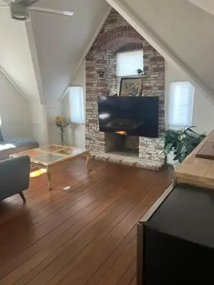 a living room with a fireplace and a tv at The Magic castle Unit 1-2 in Santa Clarita