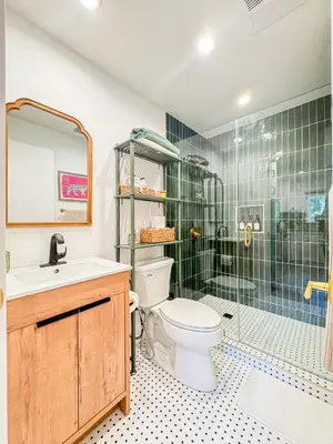 a bathroom with a toilet and a glass shower at Cozy Designer Guesthouse with Style - RE in Calabasas