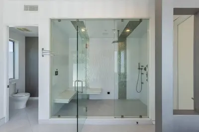 a glass shower in a bathroom with a toilet at 5BR Modern West Hollywood Retreat in Los Angeles