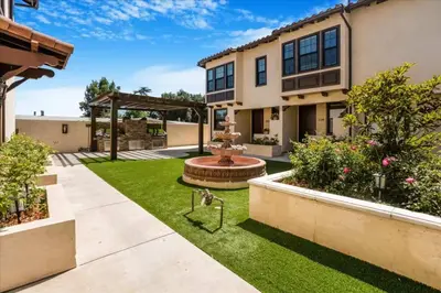 a backyard with a fountain and grass at Newly Built Pasadena Retreat Parking Great Location in Pasadena