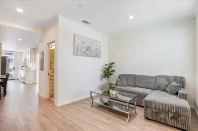 a living room with a couch and a table at Newly Built Pasadena Retreat Parking Great Location in Pasadena