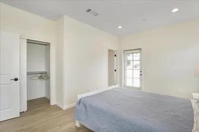 a white bedroom with a bed and a window at Stylish Pasadena Stay Near Old Town & Rose Bowl in Pasadena