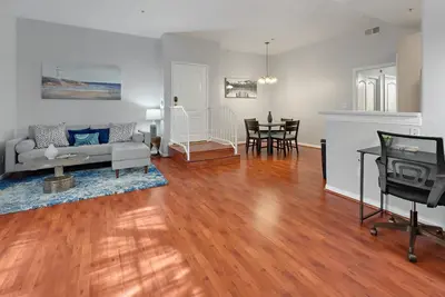 a living room with a couch and a table at Quiet 1- bedroom condo near LAX, SoFi, and the Beach in Los Angeles