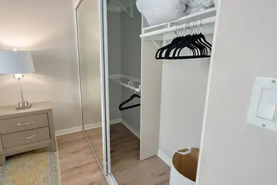 a walk in closet with a mirror in a room at Quiet 1- bedroom condo near LAX, SoFi, and the Beach in Los Angeles