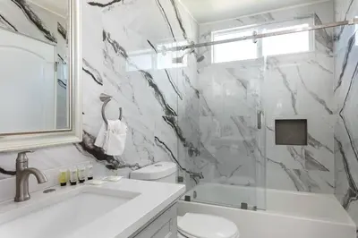 a bathroom with a sink and a toilet and a shower at Central 3BR Apt Near Americana in Glendale