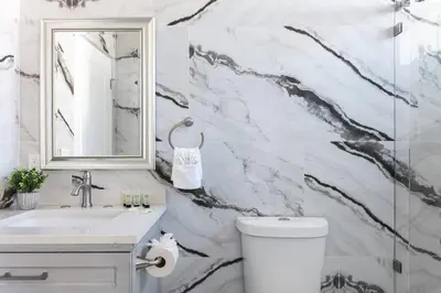 a bathroom with a sink and a toilet and a mirror at Central 3BR Apt Near Americana in Glendale