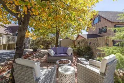 a backyard with a couch and a tree at The Great Escape Beach Access, Near Slopes, View in Lake Arrowhead