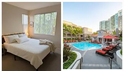 a hotel room with a bed and a swimming pool at 1BR Luxury Apartment - Luxury Resort Amenities in Los Angeles