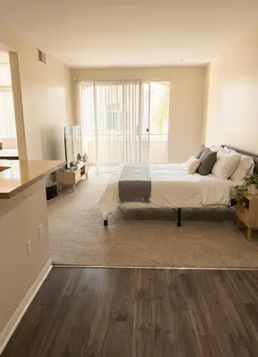 a bedroom with a bed and a living room at 1BR Luxury Apartment - Luxury Resort Amenities in Los Angeles