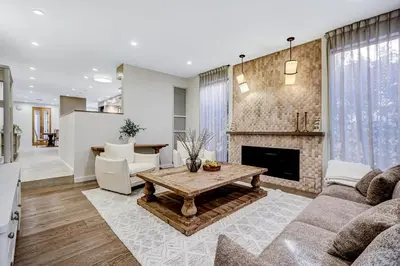 a living room with a couch and a fireplace at Modern LA Villa 5BR Home with Private Pool & Yard in Los Angeles