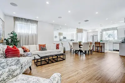 a living room with a couch and a table at Modern 4BR Villa Spacious Stylish In Prime Location in Los Angeles