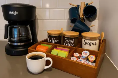 a cup of coffee sitting next to a coffee maker at Ocean View Balcony, 4 Min Walk to Beach in Manhattan Beach