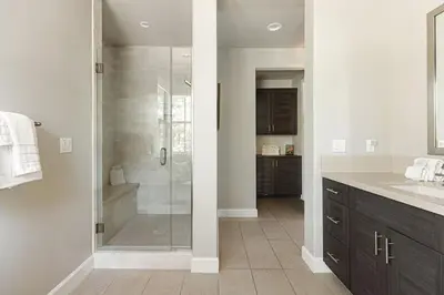 a bathroom with a shower with a glass door at The Reel Deal, Luxury Family Cabin by Alpine Slide in Big Bear Lake