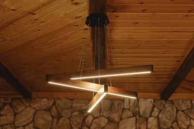 a chandelier hanging from a ceiling in a room at Lakeside Lodge - Deck Views, Golf, Basketball, Spa in Fawnskin