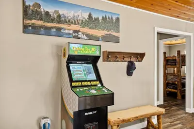 a video game machine in the corner of a room at Lawliss Hideout in Big Bear Lake in Big Bear Lake