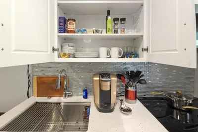 a kitchen counter with a coffee maker on it at Walk to Hollywood Blvd Chic LA Studio with Patio! in Los Angeles