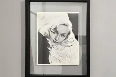 a black and white photo of a woman in a dress at Walk to Hollywood Blvd Chic LA Studio with Patio! in Los Angeles