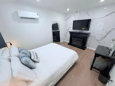 a bedroom with a bed and a flat screen tv at Private 1BR 1BA Suite, Kitchen, Fireplace, Parking in Simi Valley