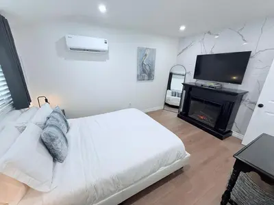 a bedroom with a bed with a fireplace and a television at Private 1BR 1BA Suite, Kitchen, Fireplace, Parking in Simi Valley