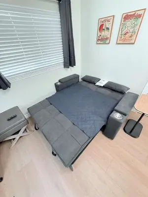 a bed in the corner of a room at Private 1BR 1BA Suite, Kitchen, Fireplace, Parking in Simi Valley