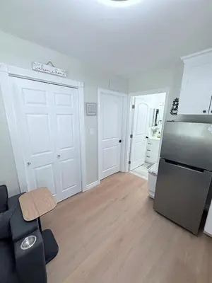 a living room with a refrigerator and a kitchen at Private 1BR 1BA Suite, Kitchen, Fireplace, Parking in Simi Valley