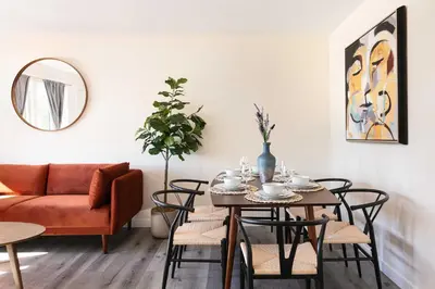 a living room with a table with chairs and a couch at Unwind in Spacious 2BR Apt Sleeps 6 with Parking in Glendale