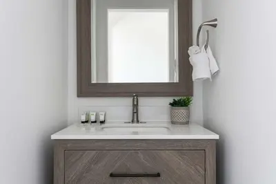 a bathroom with a sink and a mirror at Enjoy Stylish 3BR Apt Sleeps 6 with Free Parking in Glendale