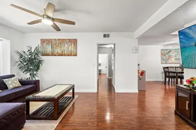 a living room with a couch and a ceiling fan at Spacious Family Retreat in San Dimas Great Location in Covina