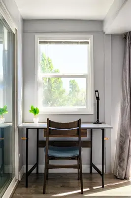 a desk with a chair in front of a window at Spacious Family Retreat in San Dimas Great Location in Covina