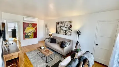 a living room with a couch and a table at Remodeled Bixby Knolls 2 bedroom unit - Close to shopping in Long Beach