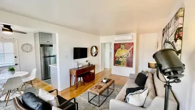 a living room with a couch and a table at Remodeled Bixby Knolls 2 bedroom unit - Close to shopping in Long Beach