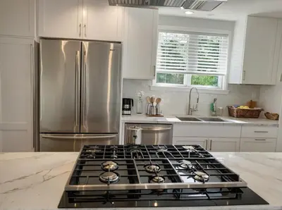 a kitchen with a stove and a refrigerator at Stay in Style Hollywood Residences with Free Parking in Los Angeles
