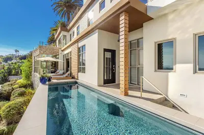 a swimming pool in the backyard of a house at Chateau Lumier by Stay Awhile in Los Angeles