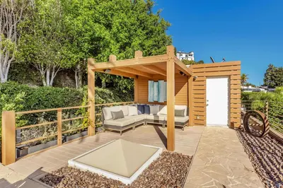 a gazebo with a couch and a chair on a patio at Chateau Lumier by Stay Awhile in Los Angeles