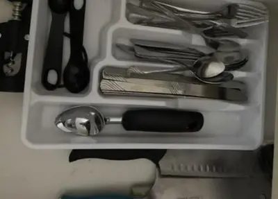 a drawer filled with utensils and utensils at Cozy Home Close to Disney in Orange