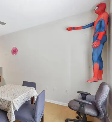a room with a spider man mural on the wall at Cozy Home Close to Disney in Orange