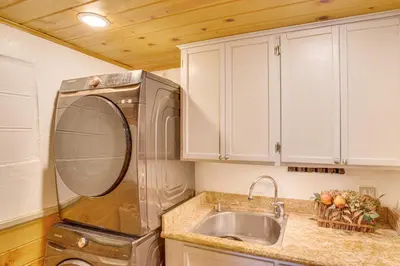 a kitchen with a sink and a dishwasher at 3 Mi to Snow Summit Charming Home with Fenced Yard in Big Bear Lake