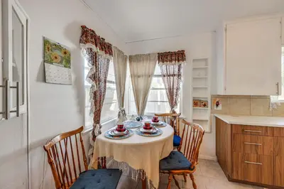 a kitchen with a table with a table cloth on it at High Walkability! Extended Stay in Riverside in Riverside